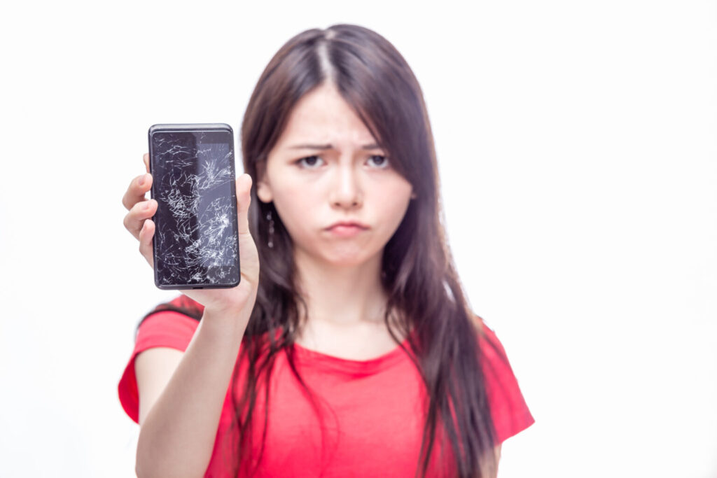 chinese woman woth cracked cell phone chinese woman woth cracked cell phone